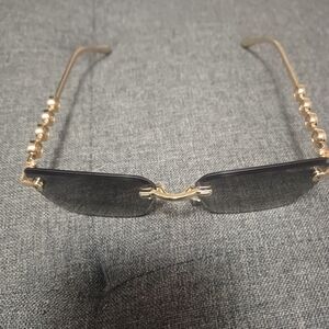 Elegant Gold and Black Sunglasses